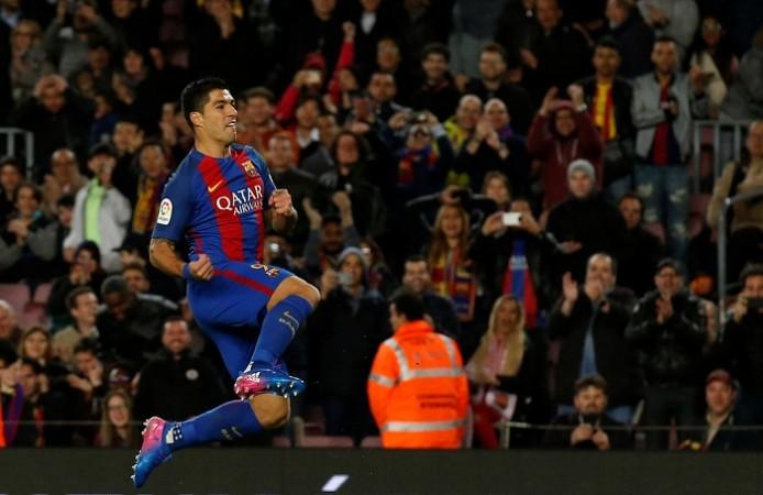 Barcelona forward Luis Suarez celebrates after scoring against Sporting Luis Suarez, Barcelona, Real Madrid, La Liga, Sporting Gijon