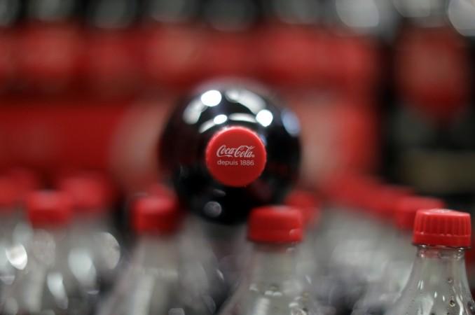 Bottles of Coca-Cola are seen in a Casino supermarket in Mouans Sartoux, France, October 27, 2016. pepsi in india, coca cola in india, pepsi,coke controversy in india, tamil nadu boycott pepsi, tn traders boycott pepsi, coke