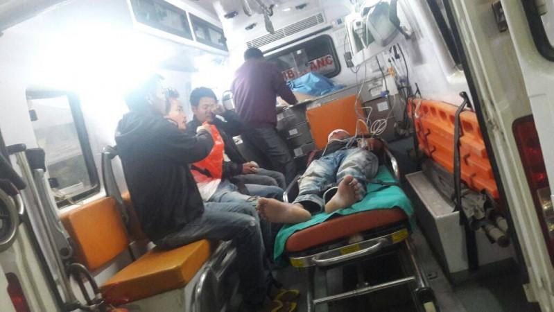 A civilian undergoing treatment after being injured in a bomb blast