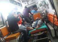 A civilian undergoing treatment after being injured in a bomb blast