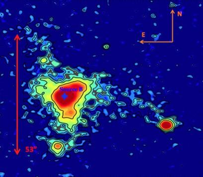MAMMOTH-1 is an extended blob of gas in the intergalactic medium called an enormous Lyman-alpha nebula (ELAN). The color map and contours denote the surface brightness of the nebula, and the red arrows show its estimated spatial extent. nebula, space, MAMMOTH-1, blob of gas,