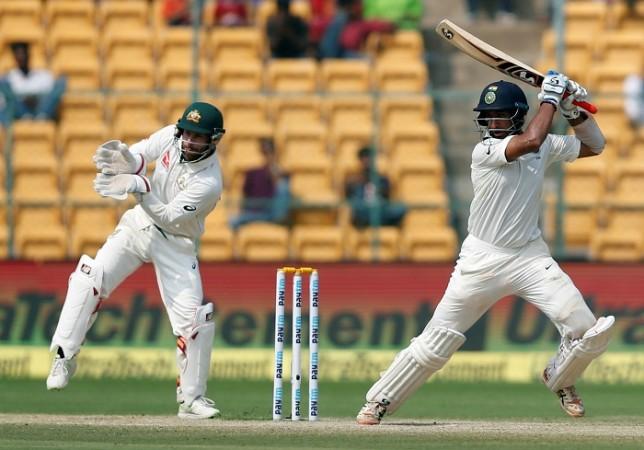 Cheteshwar Pujara slams the ball through the offside during his unbeaten half-century on day three of the second Test, March 6, 2017 Cheteshwar Pujara, India, Australia, Matthew Wade, Day 3