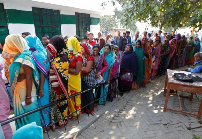Voters queue to cast their votes at a polling station during the fourth phase of the state assembly election in Allahabad, India, February 23, 2017 assembly election results 2017, uttar pradesh election results 2017, up election results 2017, voting in uttar pradesh, chief ministerial candidates of uttar pradesh