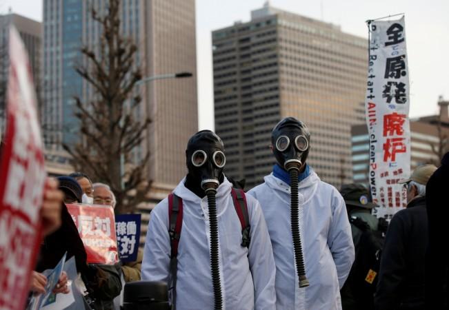 Anti-nuclear protesters gather at a rally in front of the parliament building in Tokyo, Japan March 11, 2017, to mark the six-year anniversary of the March 11, 2011 earthquake and tsunami that killed thousands and set off a nuclear crisis. Fukushima, Nuclear disaster, government, health,