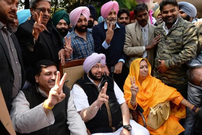 In picture: Punjab Congress leaders, including Captain Amarinder Singh (sitting, centre) celebrate the party's victory in the state. Captain Amarinder Singh
