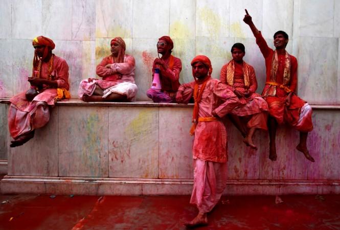 Hindu devotees take part in Holi in Nandgaon village, in the state of Uttar Pradesh, India. Holi 2017