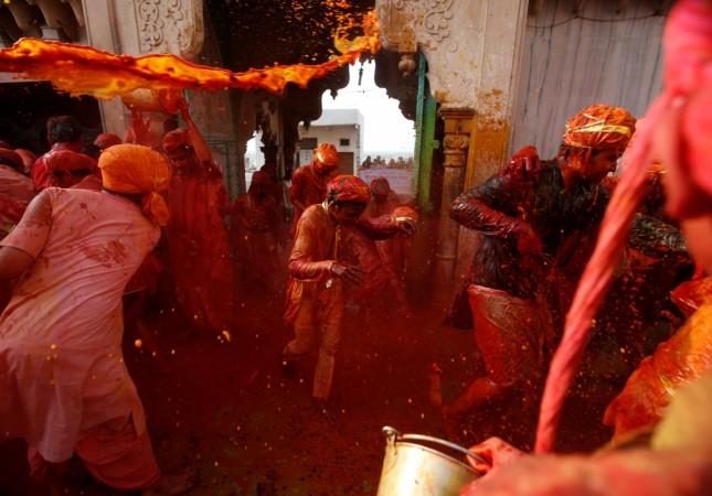 Hindu devotees take part in Holi in Nandgaon village, in the state of Uttar Pradesh, India. Holi 2017