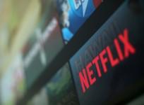 The Netflix logo is pictured on a television