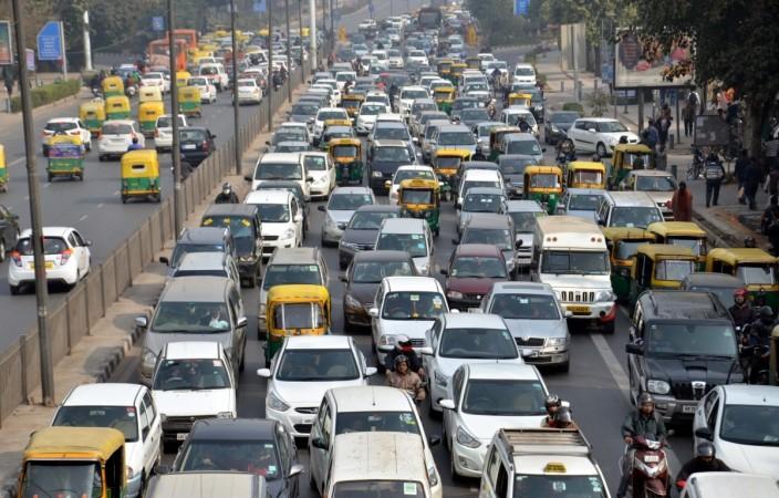 Vehicles moving at a junction in New Delhi on Jan 23, 2017. cars, car sales, domestic car sales, gst on cars, car sales may 2017, siam car sales may 2017