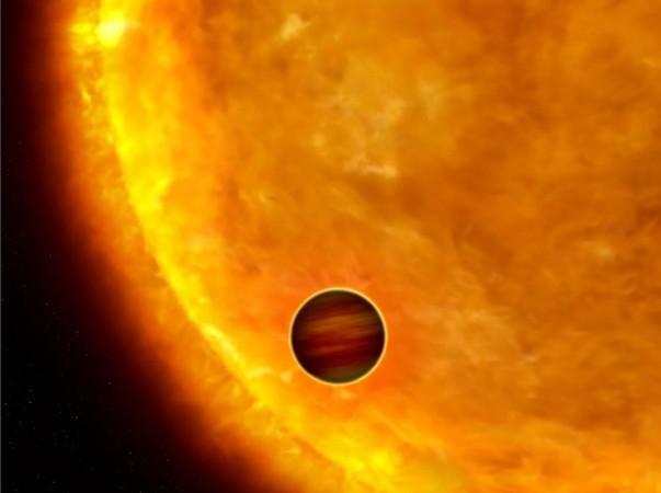 An artist's impression of a Jupiter-size planet, KELT-16b, orbits incredibly close to its star and completes its orbit in less than a day's time. KELT, KELT-16b, KELT-16, hot Jupiter, space,