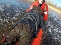 Watch the moment daring rescuers pull freezing fisherman from Estonian lake