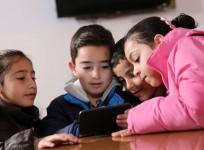Children playing educational game on smartphone
