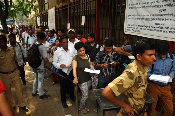 NRIs queue-up outside the Reserve Bank of India to exchange demonetised notes in Mumbai on March 29, 2017. rbi, rbi circular for nris, rbi updates on exchanging old notes, demonetisation, exchange of old notes at rbi office, list of rbi offices, rbi circular for old notes for nris