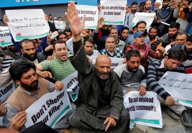 Demonstrators shout slogans and hold banners during a protest against Indian Prime Minister Narendra Modi's visit to the Jammu and Kashmir region to inaugurate the Chenani-Nashri tunnel, in Srinagar, April 2, 2017. srinagar strike, chenani nashri