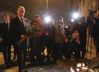 Vladimir Putin lays flowers at St Petersburg metro station blast site