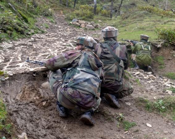 Soldiers take position during a gun fight between security forces and militants in which three soldiers and a militant were killed n Jammu and Kashmir's Bandipora district on Feb 14, 2017. Bandipora