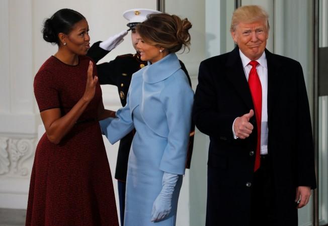 Michelle Obama greets Melania Trump at the White House in Washington before inauguration. Michelle Obama greets Melania Trump inauguration, Michelle Obama, Melania Trump, Melania Trump white house photo, Michelle Obama natural hair photo,