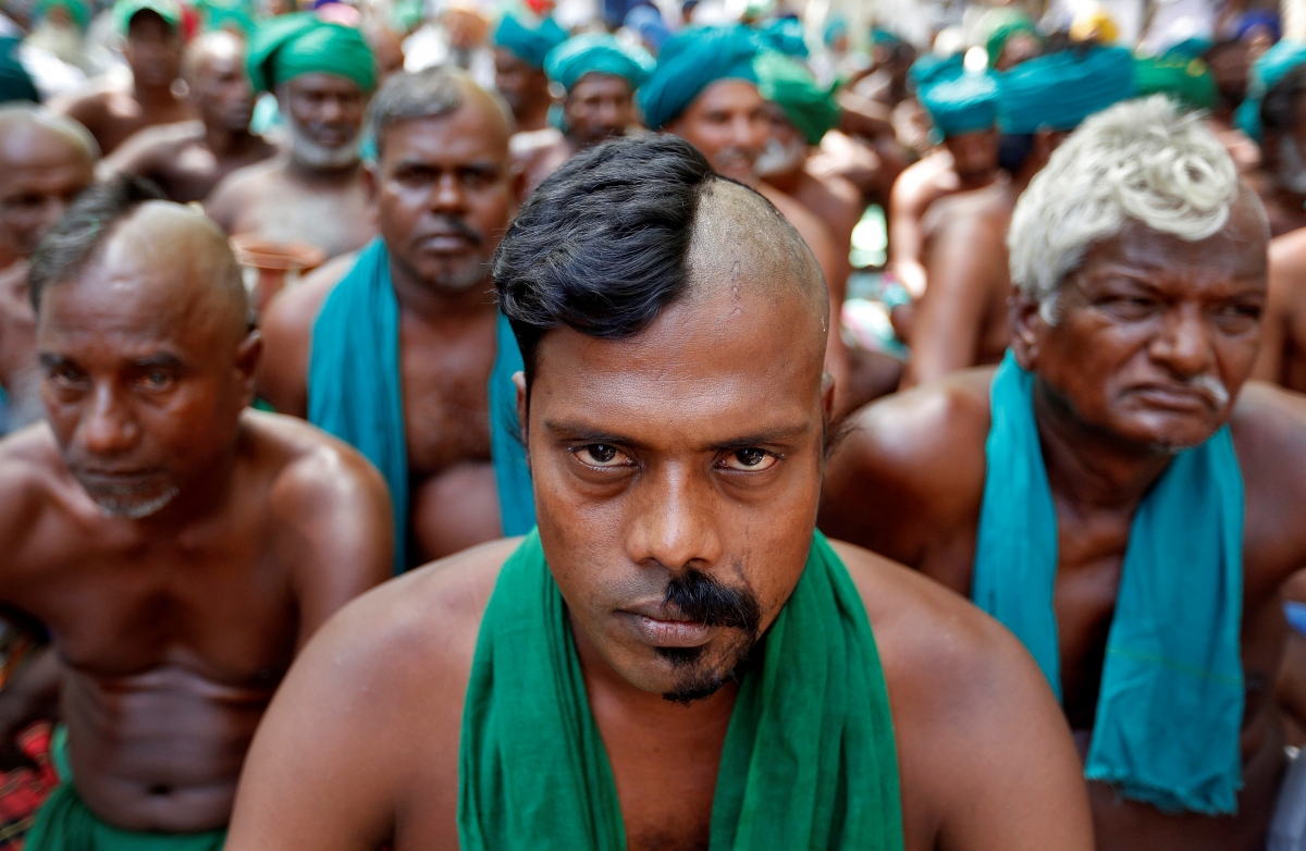 Farmers from the southern state of Tamil Nadu pose half shaved during a protest demanding a drought-relief package from the federal government, in New Delhi, India April 3, 2017. indian farmer, farm loan waiver, up govt waives farm loans, bjp kisan morcha, congress govt, bank loans, rbi governor urjit patel