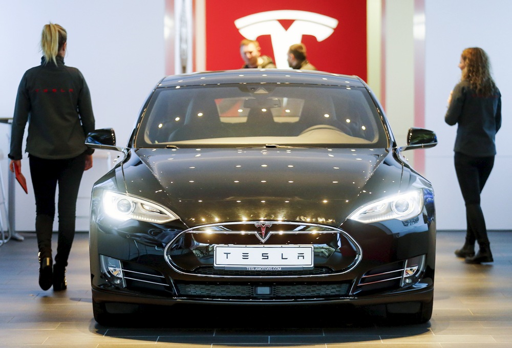 A Tesla car 'Model S' sits in a dealership in Berlin, Germany, November 18, 2015 Tesla Model S, Tesla Motors, Elon Musk