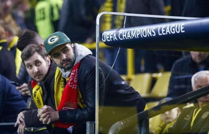 Fans wait inside the Borussia Dortmund stadium, April 11, 2017 Borussia Dortmund, fans, team bus, explosions, Champions League