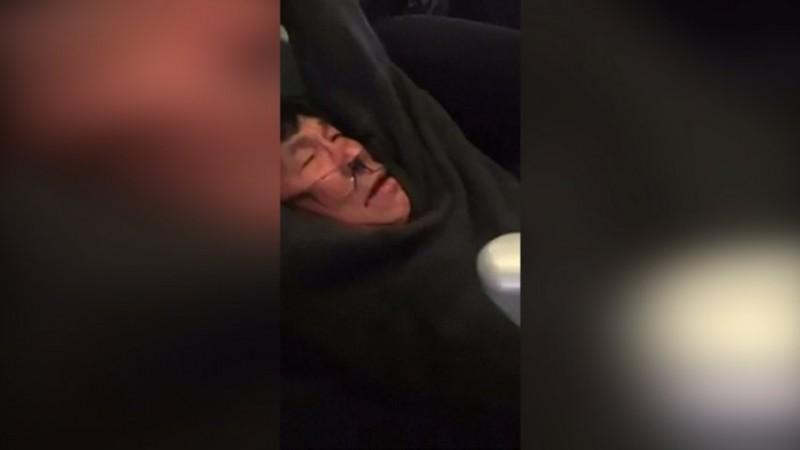 Image of the doctor who was physically dragged from the overbooked flight United Airlines sparks outrage after doctor physically dragged from overbooked flight