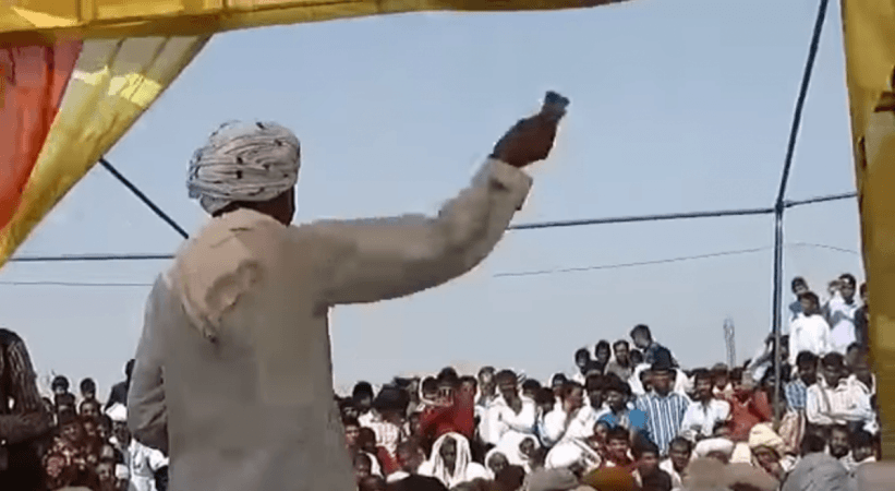 Leela Ram Gujjar, a tea-seller in Bhiwadi, Rajasthan standing with a bundle of cash in his hand. He reportedly gave Rs 1.5 crore dowry for daughters' wedding. dowry viral video
