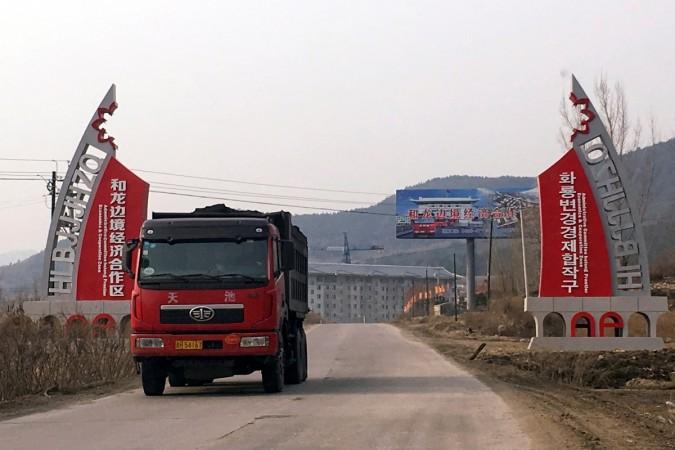 A truck carries coal on a road out of the Helong Frontier Economic Cooperation Zone, in Nanping, Jilin province, China, March 27, 2017 china, chinese economy, china gdp growth for 2017, world bank report on china, chinese president xi jinping