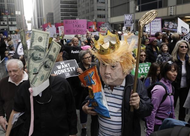 People march demanding President Donald Trump release his tax returns, in New York, U.S., April 15, 2017. Trump tax march
