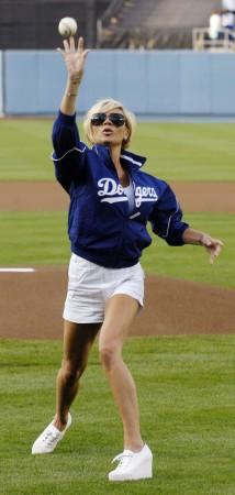 Victoria Beckham throws out the first ball before an MLB baseball game Victoria Beckham