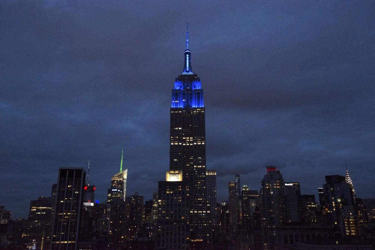 The Empire State Building is illuminated with blue lights to commemorate the 70th anniversary of the United Nations. Empire State Building