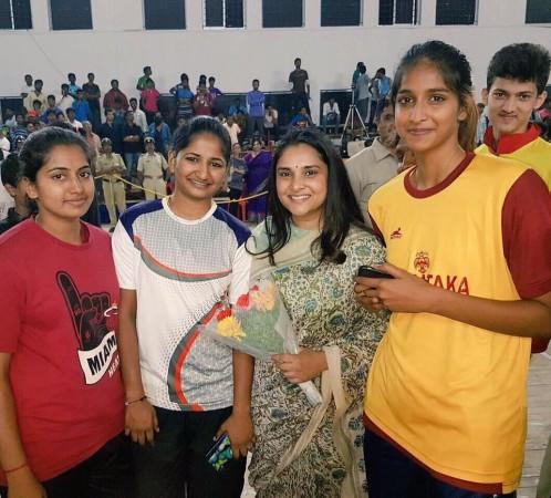 Ramya with youngsters at an event. Ramya