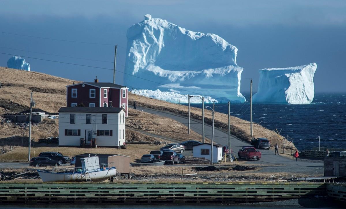 Residents view the first iceberg of the season as it passes the South Shore of Newfoundland. Canada ice berg