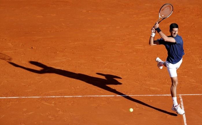Novak Djokovic rips a backhand during his match against Pablo Carreno Busta Novak Djokovic, Monte Carlo Masters, David Goffin, quarterfinals, Pablo Carrreno Busta