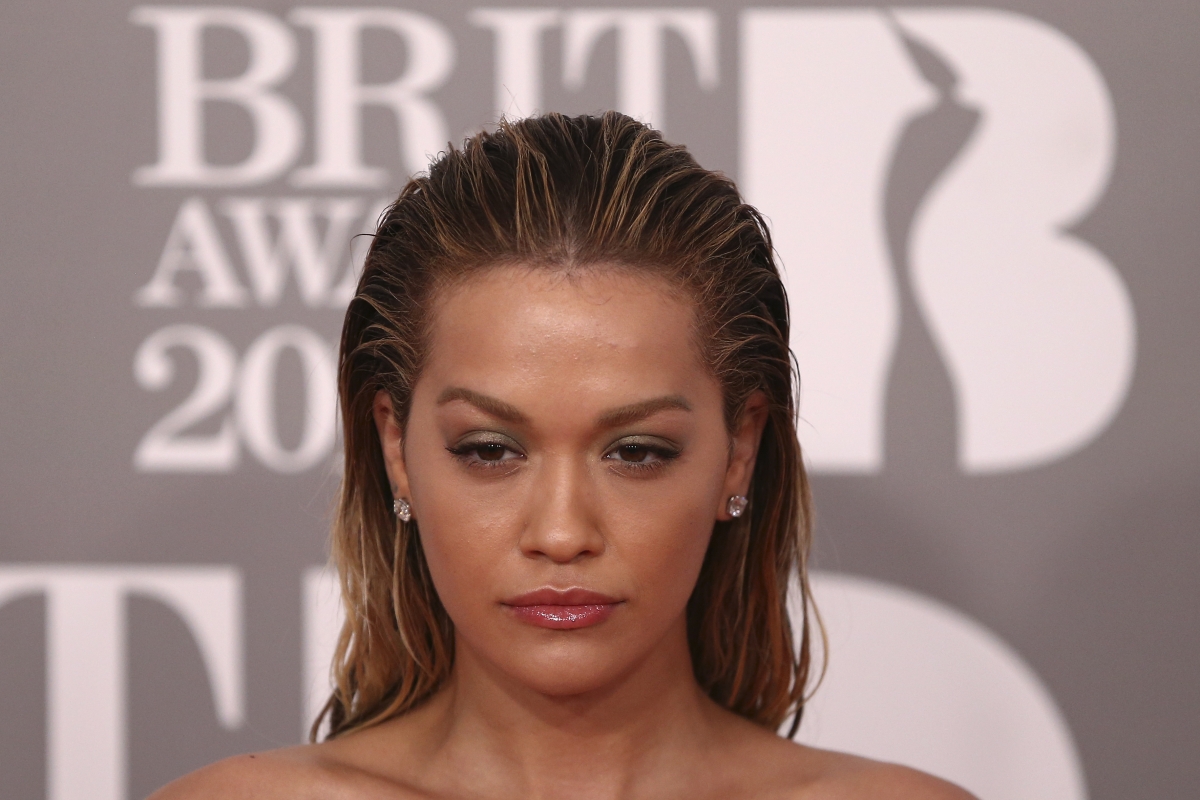 Rita Ora risks MAJOR wardrobe malfunction in gold dress during China ...