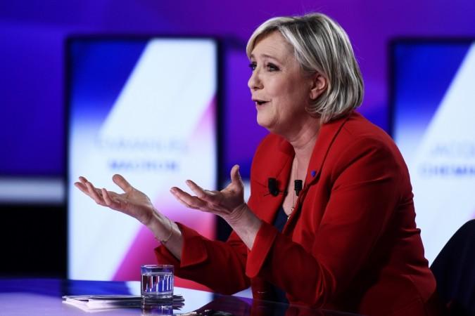 Marine Le Pen, French National Front (FN) political party leader and candidate for French 2017 presidential election, attends the France 2 television special prime time political show, french presidential elections, french centrist candidate Emmanuel Macron, marine le pen, frexit, indian stock markets, wipro q4 results