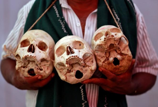 A farmer from the southern state of Tamil Nadu displays skulls, who he claims are the remains of Tamil farmers who committed suicide, during a protest demanding a drought-relief package from the central government, in New Delhi, India March 22, 2017. Tamil Nadu Farmers