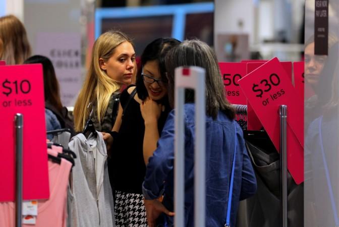 Shoppers look at items on sale in a retail store in central Sydney, Australia, March 19, 2017. Picture taken March 19, 2017. australia, amazon in australia, australian retailers to wage war on amazon, australian retail market