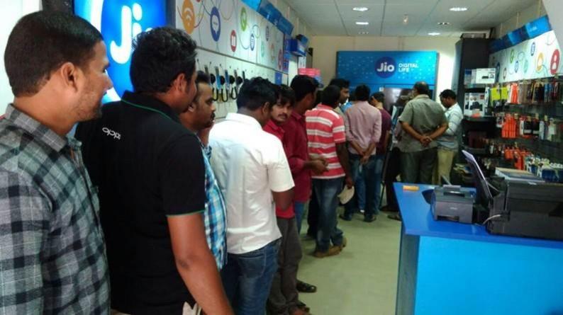 People throng a Reliance store to to grab Jio Prime Membership in Lucknow on March 30, 2017. reliance industries results, ril q4 results, ril q4 earnings, ril share price, mukesh ambani controlled ril, ril gross refining margin, sensex