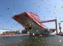 China unveils first home-built aircraft carrier