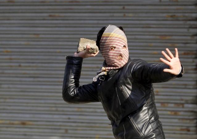 A stone-pelter in Srinagar on January 21, 2016. Stone pelting jammu and kashmir