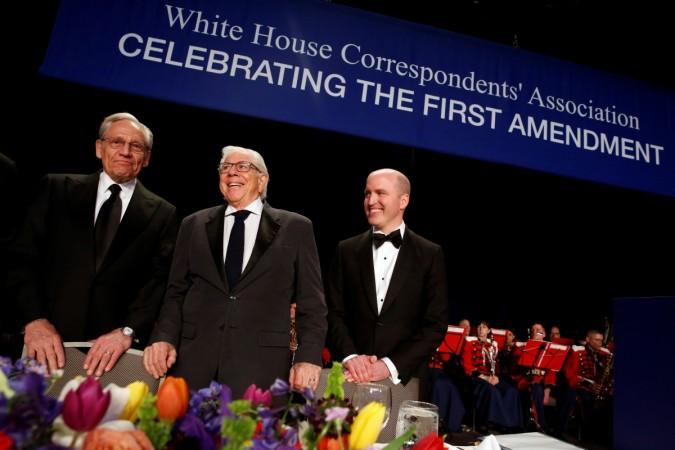 Former Washington Post reporters Bob Woodward (L-R) and Carl Bernstein stand with White House Correspondents' Association President Jeff Mason of Reuters at the head table before the association's dinner in Washington. White House Correspondents' dinner