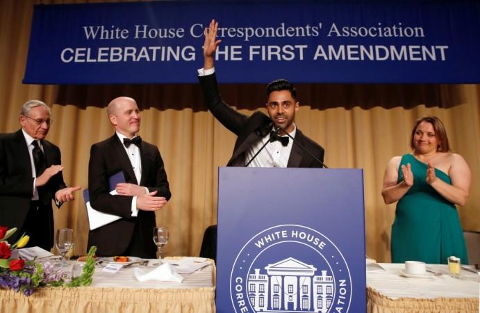 Members of the head table applaud as Hasan Minhaj (2nd R) of Comedy Central finishes his performance at the White House Correspondents' Association dinner in Washington White House Correspondents' Association dinner