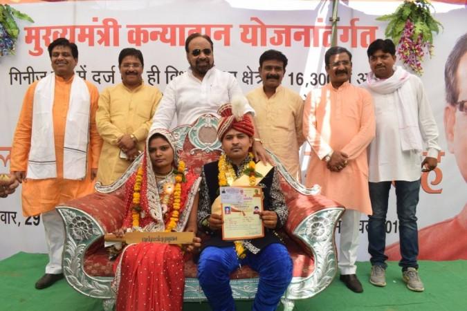 In picture: MP minister Gopal Bhargava (standing, centre) at the mass marriage ceremony where brides were gifted bats to beat their husbands with if they turned alcoholic. Gopal Bhargava