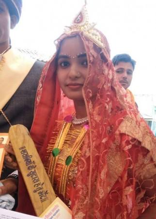In picture: A bride with a bat to beat her husband. Gopal Bhargava