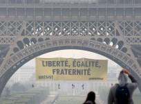 Greenpeace activists climb Eiffel Tower in Marine Le Pen protest
