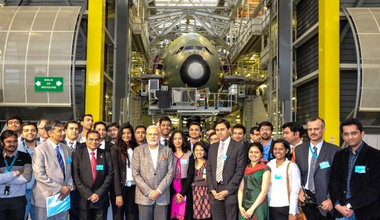 Prime Minister Narendra Modi poses with Indian students during a visit at the Airbus headquarters in Toulouse April 11, 2015. french elections 2017, french polls 2017, Élysée palace, centrist emmanuel macron, far right marine le pen, french economy, india france bilateral trade, paris fashion, fashion shows in paris
