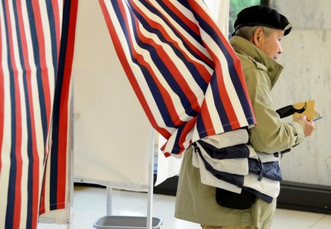 In picture: A French citizen living in the United States leaves a voting booth after casting his ballots in the French presidential run-off between Emmanuel Macron and Marine Le Pen, at the French Embassy in Washington, US, on May 6, 2017. French presidential election