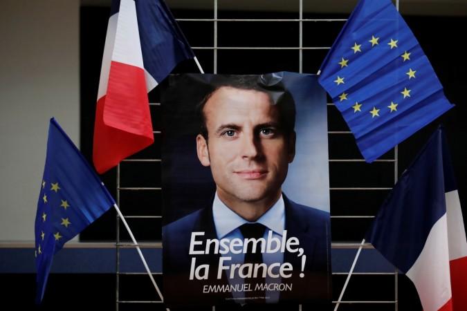 An electoral poster of Emmanuel Macron, head of the political movement En Marche !, or Onwards ! Emmanuel Macron