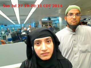 Tashfeen Malik, (L), and Syed Farook are pictured passing through Chicago's O'Hare International Airport in this July 27, 2014 handout photo obtained by Reuters December 8, 2015. San Bernardino attackers