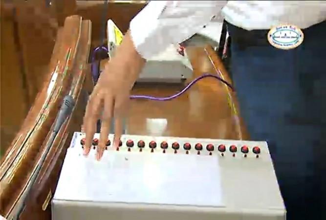 In picture: AAP MLa Saurabh Bhardwaj shows EVM in Delhi Assembly